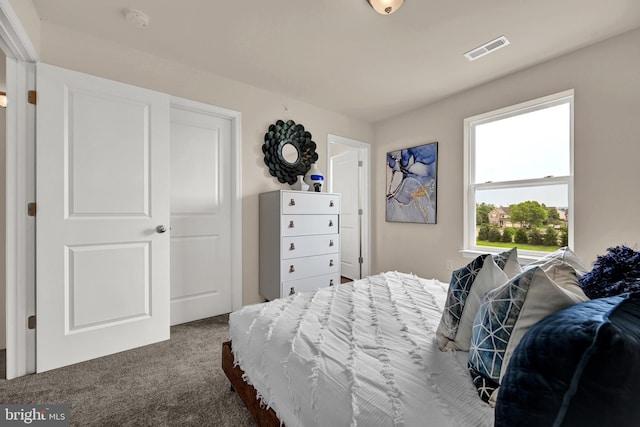 bedroom with visible vents and carpet floors