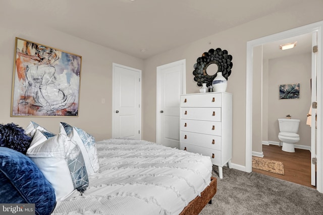 carpeted bedroom featuring baseboards