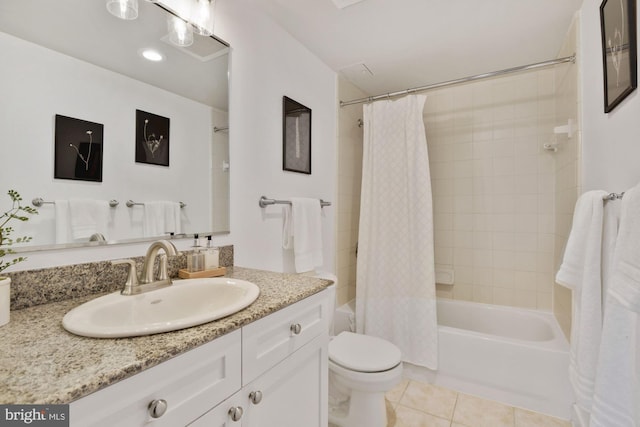 full bath with vanity, tile patterned floors, toilet, and shower / bath combo