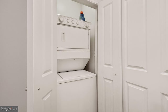 washroom featuring laundry area and stacked washer and clothes dryer