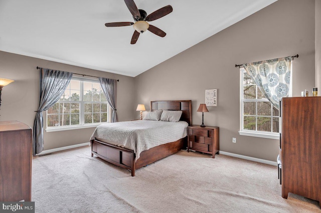 bedroom with carpet floors, a ceiling fan, baseboards, and vaulted ceiling