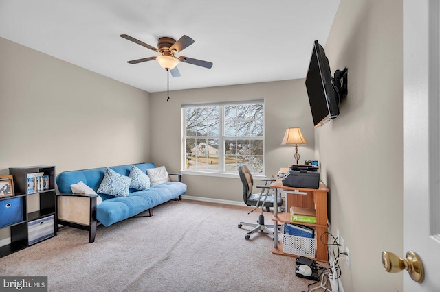 office area featuring carpet flooring, a ceiling fan, and baseboards