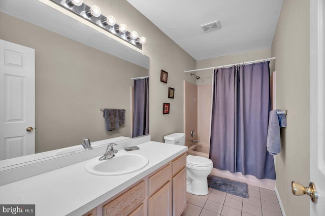 full bathroom with vanity, visible vents, tile patterned flooring, shower / tub combo, and toilet