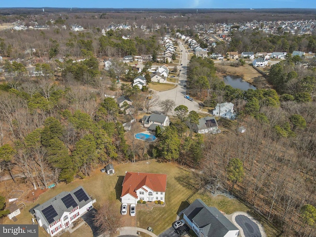 bird's eye view featuring a residential view and a water view