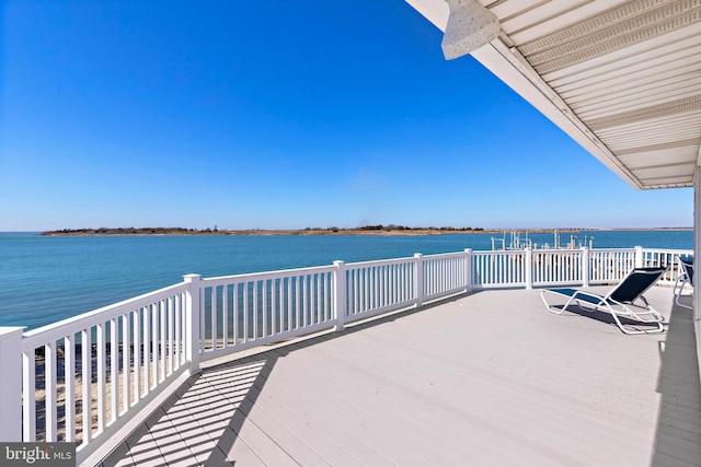 view of dock with a deck with water view