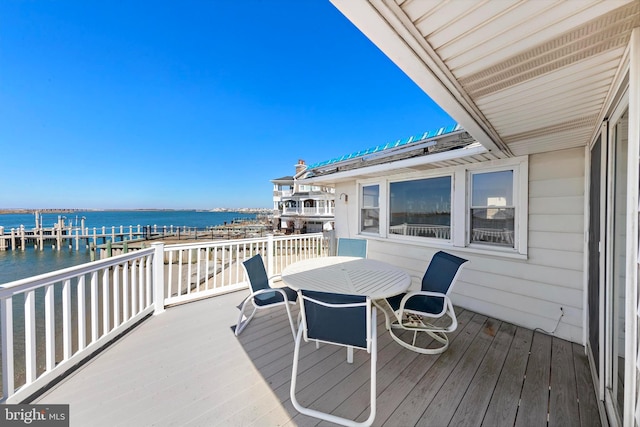 wooden terrace with a water view