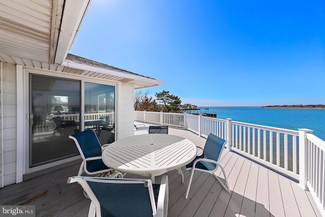 wooden deck featuring a water view