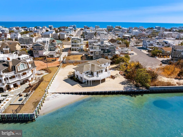 bird's eye view featuring a residential view and a water view