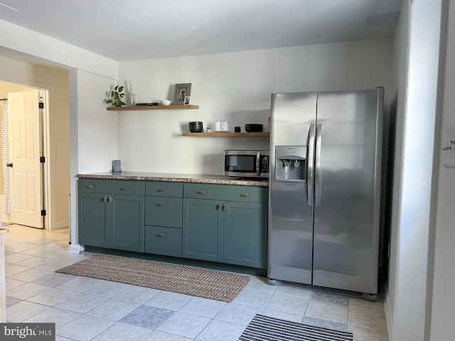 kitchen featuring open shelves, appliances with stainless steel finishes, and light tile patterned floors