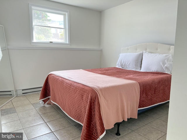 tiled bedroom with baseboard heating and a baseboard radiator