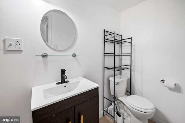 bathroom with toilet and vanity