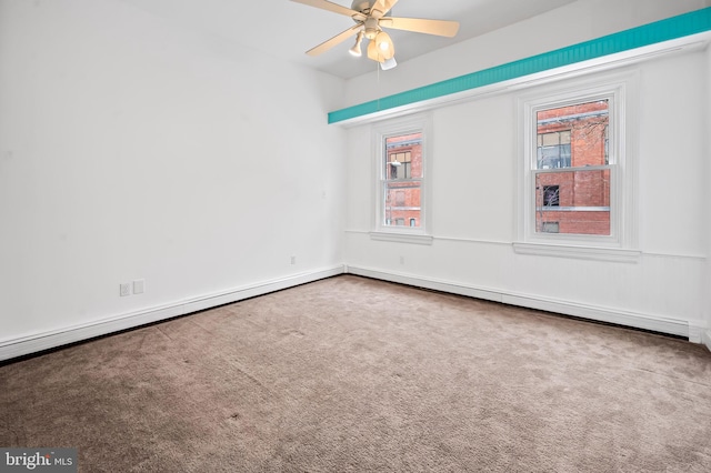 carpeted spare room featuring a ceiling fan and a baseboard radiator