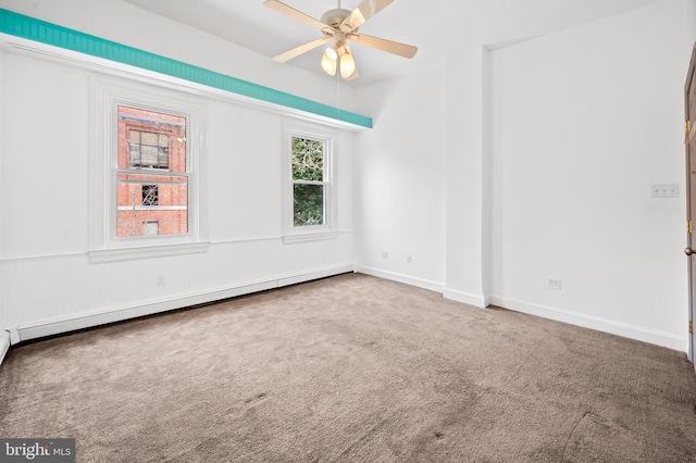 carpeted spare room featuring baseboards, a baseboard heating unit, and ceiling fan