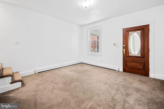 carpeted foyer entrance featuring a baseboard radiator