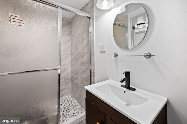 bathroom with vanity and a shower stall