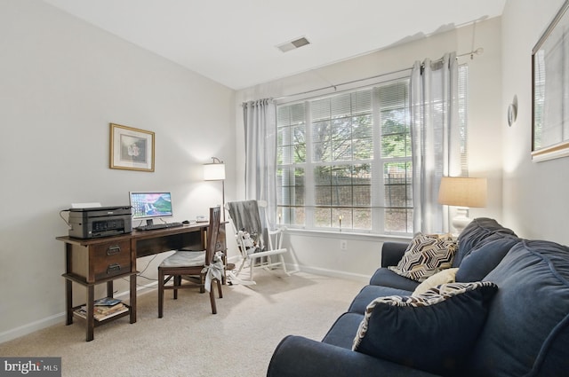office space with visible vents, baseboards, and carpet floors