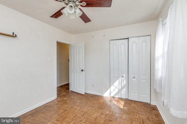 unfurnished bedroom featuring baseboards, a closet, and ceiling fan