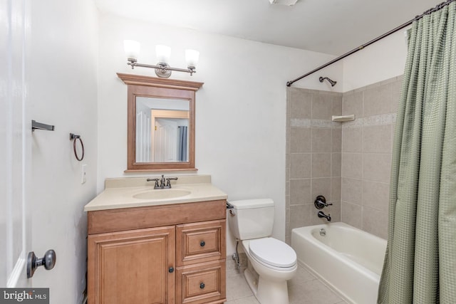 full bath with tile patterned flooring, toilet, vanity, and shower / bath combo