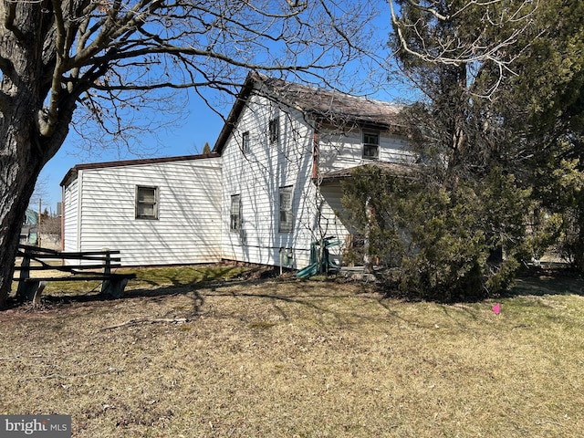 view of home's exterior featuring a yard