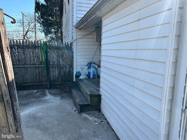 view of property exterior featuring fence