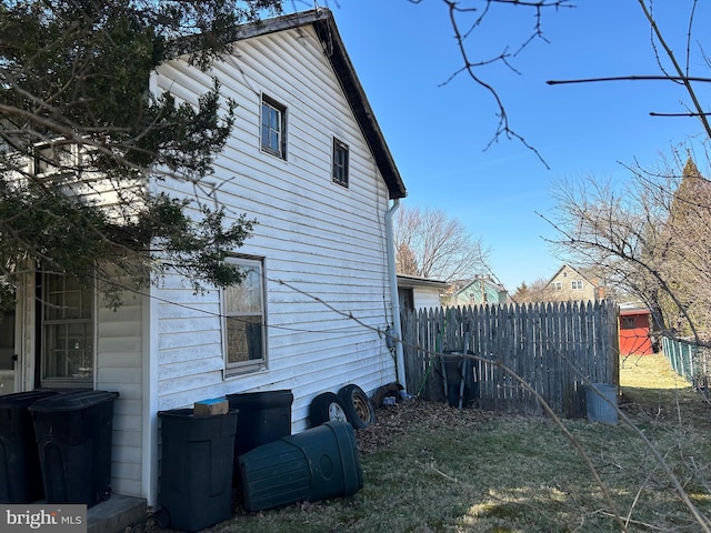 view of side of property with fence