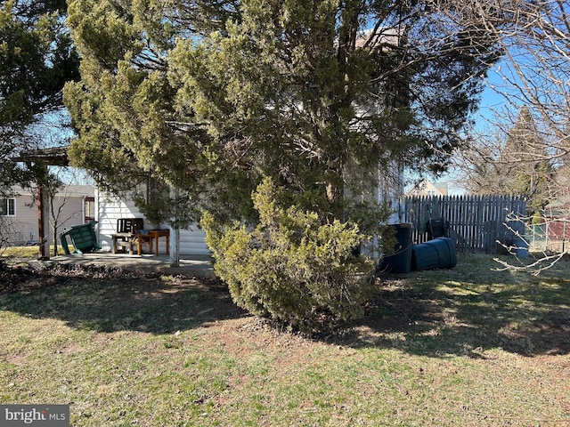 view of yard featuring a patio and fence