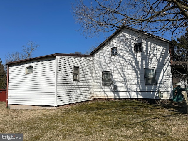 view of property exterior featuring a yard