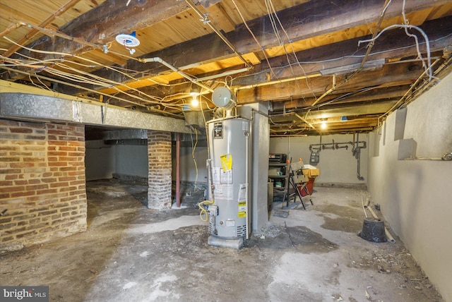 unfinished basement featuring water heater