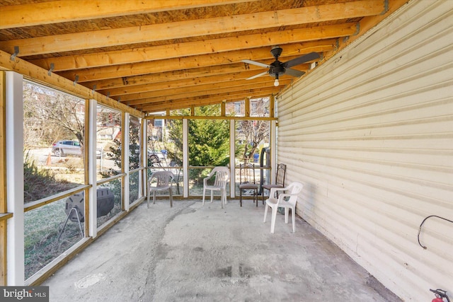 unfurnished sunroom with lofted ceiling and ceiling fan