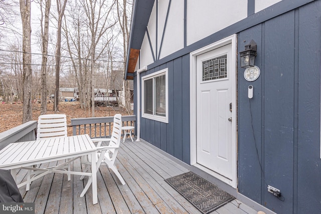 wooden deck with outdoor dining area