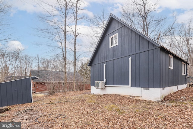 view of side of property with an outbuilding and crawl space