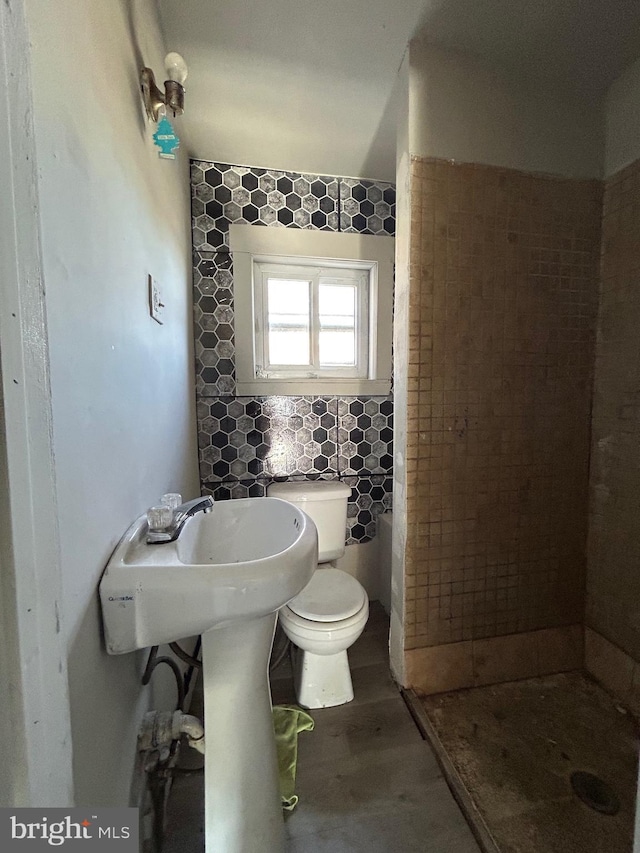 bathroom with toilet and walk in shower