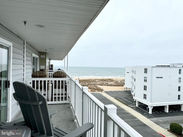 balcony with a view of the beach and a water view