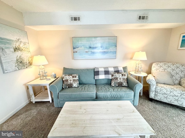 carpeted living room with visible vents and baseboards