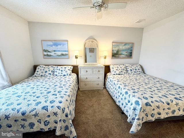 bedroom with carpet, a ceiling fan, and a textured ceiling