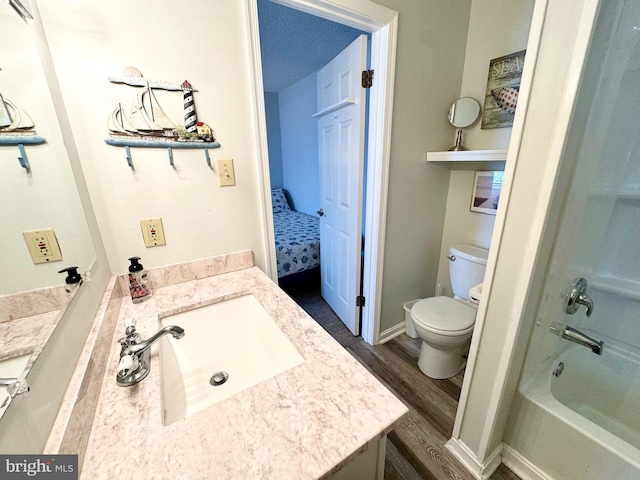 full bathroom featuring ensuite bathroom, toilet, wood finished floors, and vanity