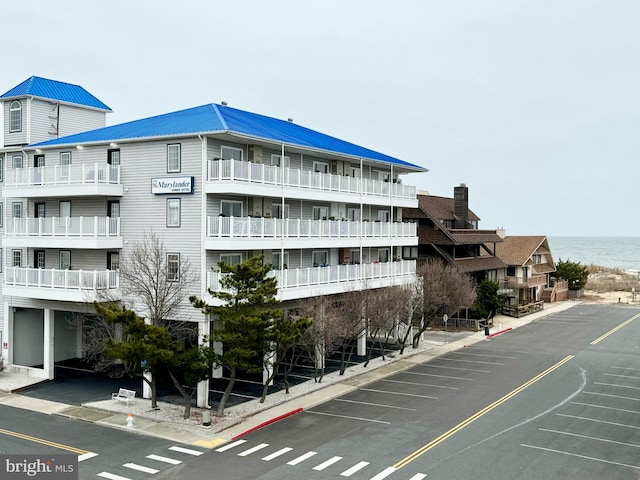 view of building exterior with a water view