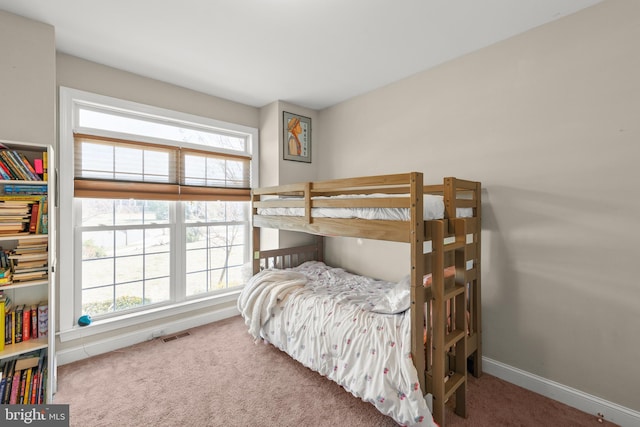 bedroom with visible vents, baseboards, and carpet floors