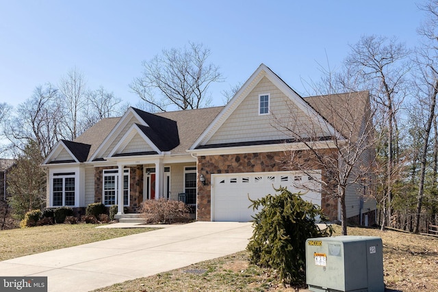 craftsman house featuring stone siding, driveway, a shingled roof, and a garage