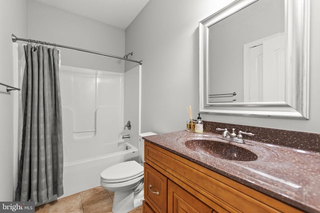 bathroom featuring toilet, shower / bath combo, vanity, and tile patterned flooring