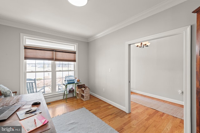 interior space featuring a notable chandelier, light wood-type flooring, baseboards, and ornamental molding