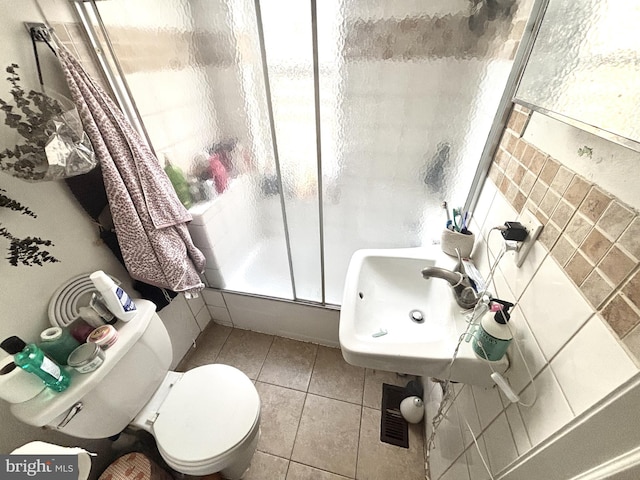 bathroom featuring a wealth of natural light and toilet