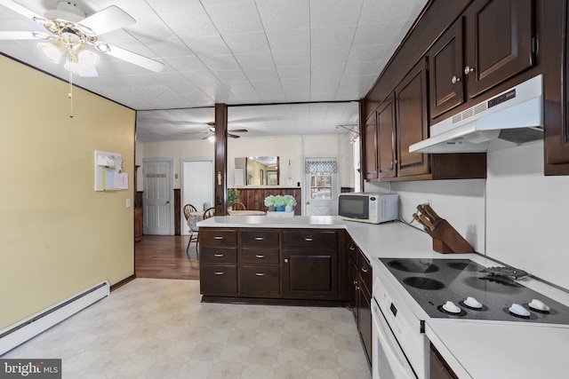 kitchen featuring under cabinet range hood, a baseboard radiator, white appliances, and a ceiling fan