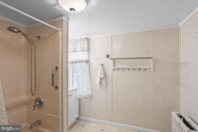 full bath with shower / bathtub combination and radiator heating unit