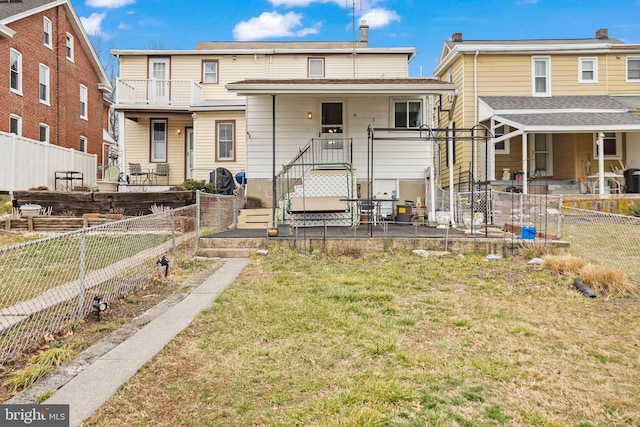 exterior space featuring a fenced backyard, a front yard, and a patio area