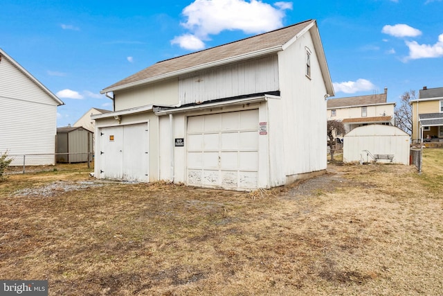 garage featuring fence