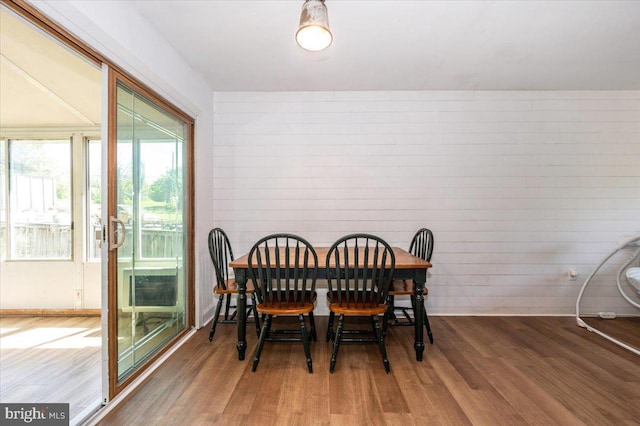 dining area with wood finished floors
