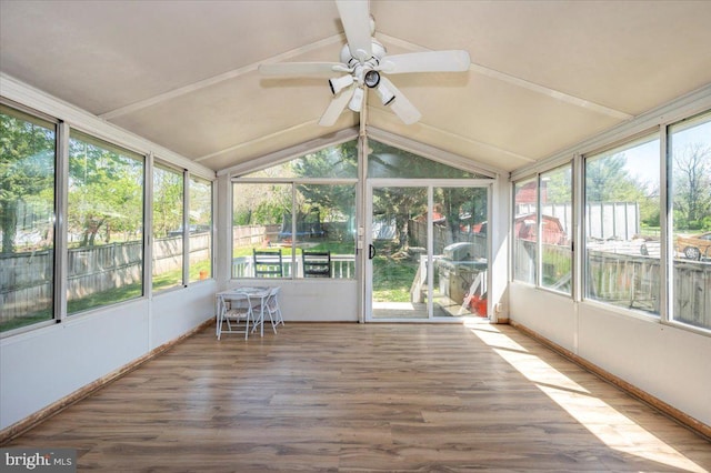 sunroom with beamed ceiling and ceiling fan