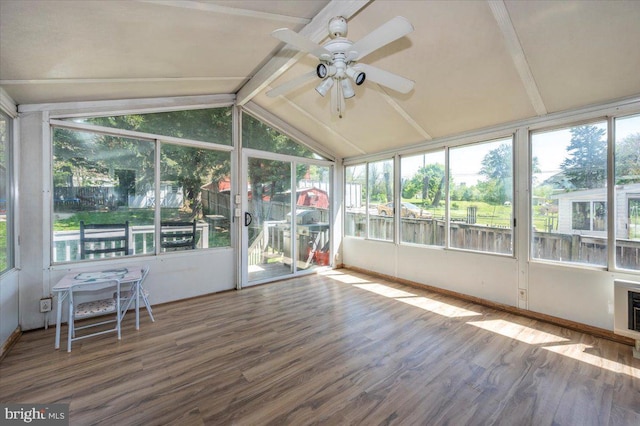 unfurnished sunroom with a ceiling fan