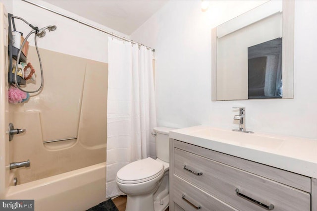 bathroom with toilet, shower / bath combo, and vanity
